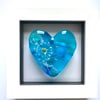 Glass heart in a frame