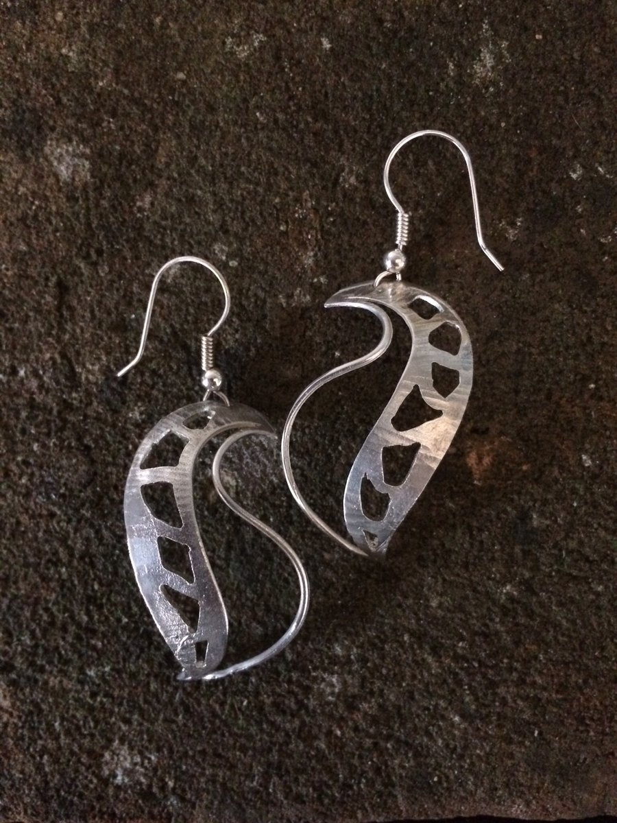 Sterling silver shell earrings with pierced design
