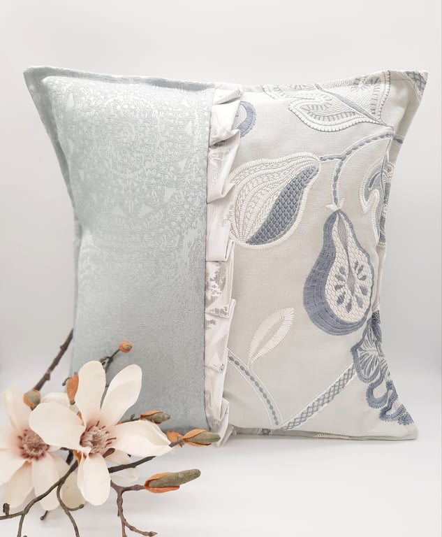 Embroidered pastel green envelope cushion cover.  