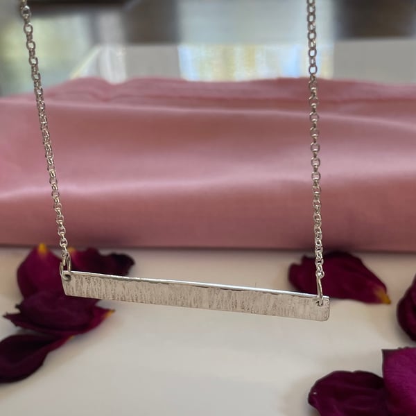Solid hammered bar pendant 