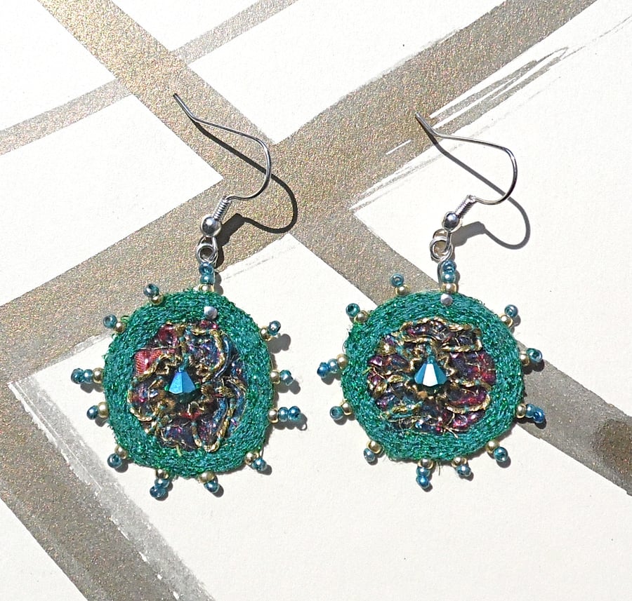 Embroidered earrings.