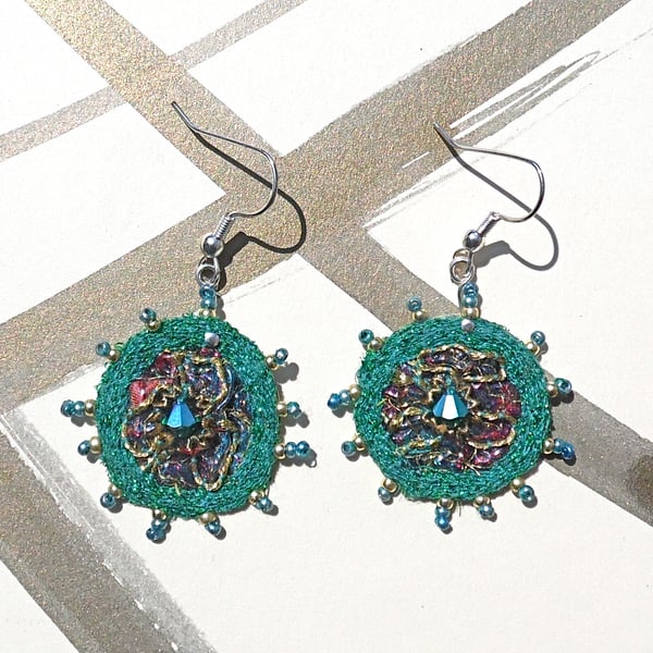 Embroidered earrings.