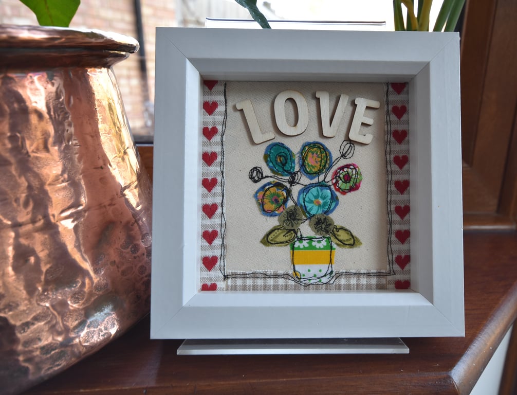 Love flower vase design using applique and free motion embroidery techniques