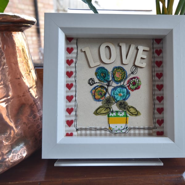 Love flower vase design using applique and free motion embroidery techniques