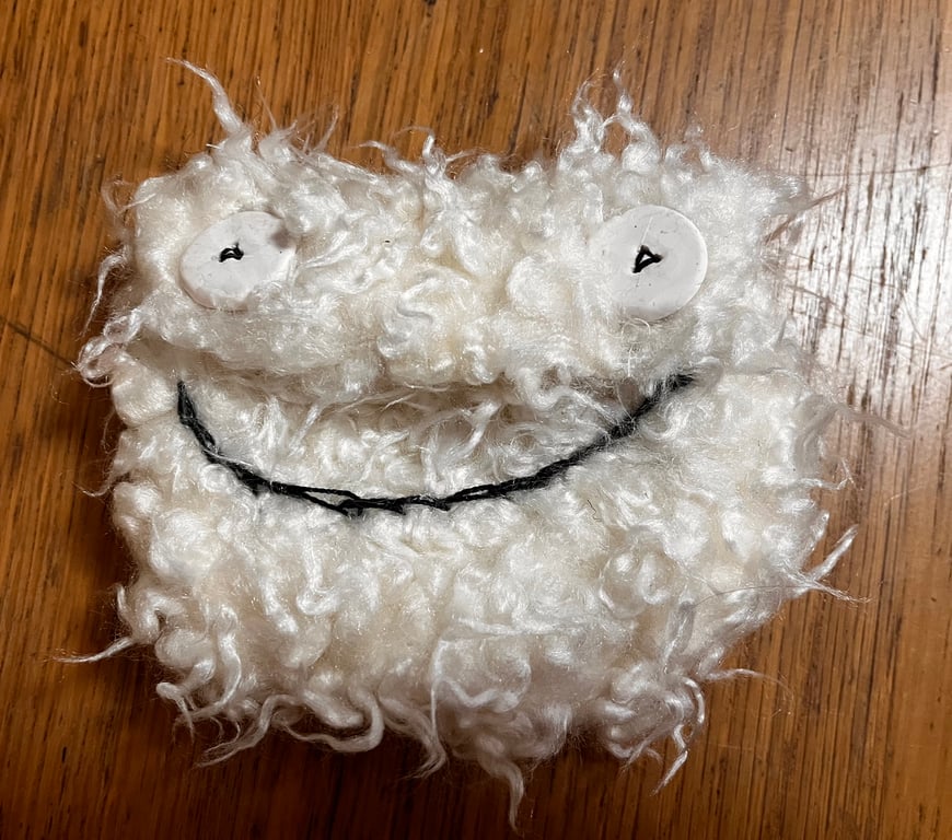 Monster face purse in cream faux fur