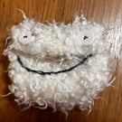 Monster face purse in cream faux fur