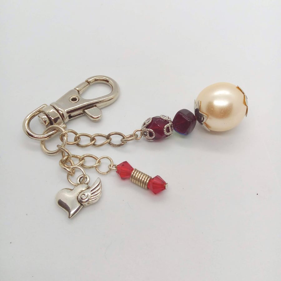 Bag Charm Made with a Silver Winged Heart Charm with Pearl and Crystal Charms