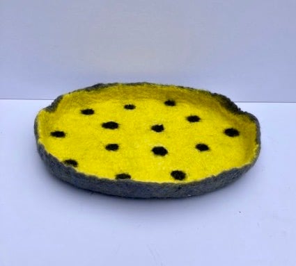 Felted yellow dotty dish.