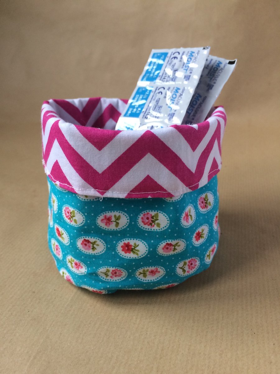 Small fabric storage basket for make up, wipes etc.
