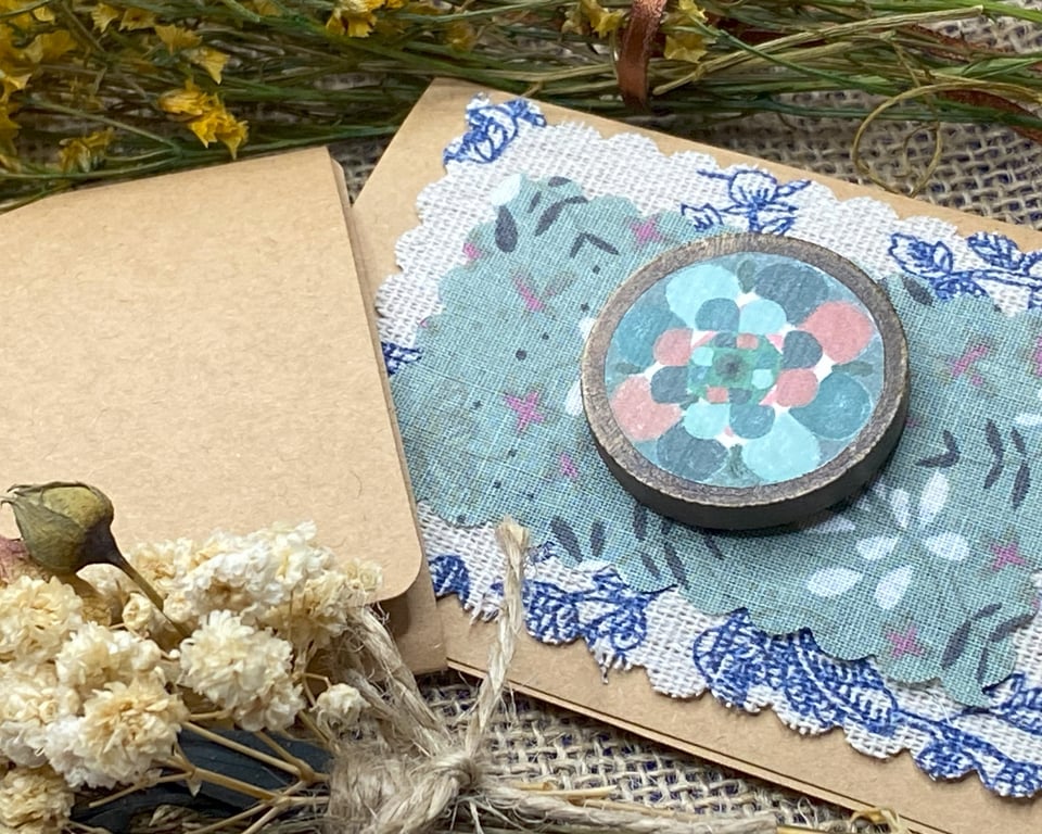 Wooden badge with woolly flower