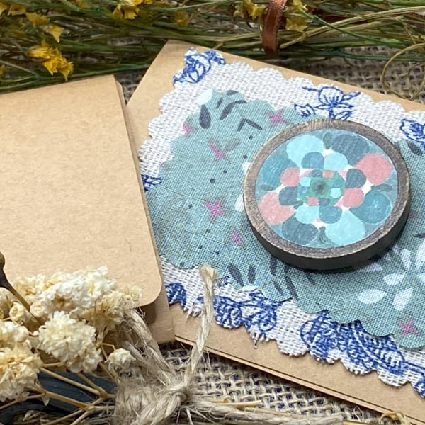 Wooden badge with woolly flower