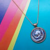 Gorgeous Blue Spiral in an Antique Gold Pendant