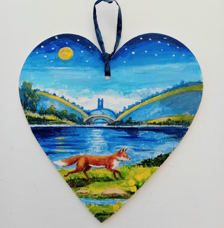 lakeside fox on a wooden heart  shape