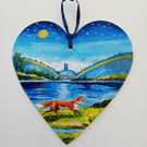 lakeside fox on a wooden heart  shape