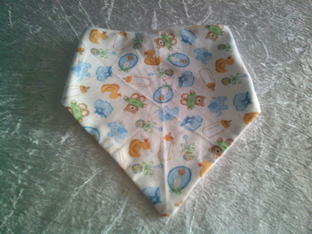 Babies Dribble Bib with Bottles, Bibs and Bootees in Blue on a Cream Background