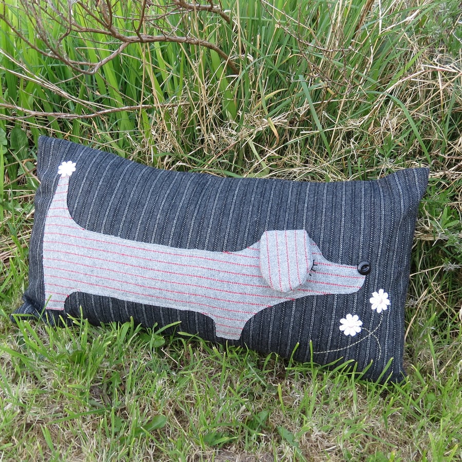 A snoozy dachshund cushion.  Long dog.  Complete with cushion pad.
