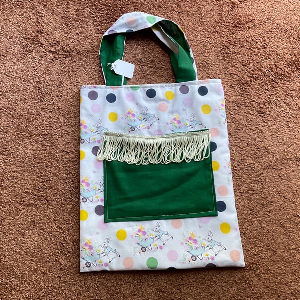 Child's bag with fringed pocket