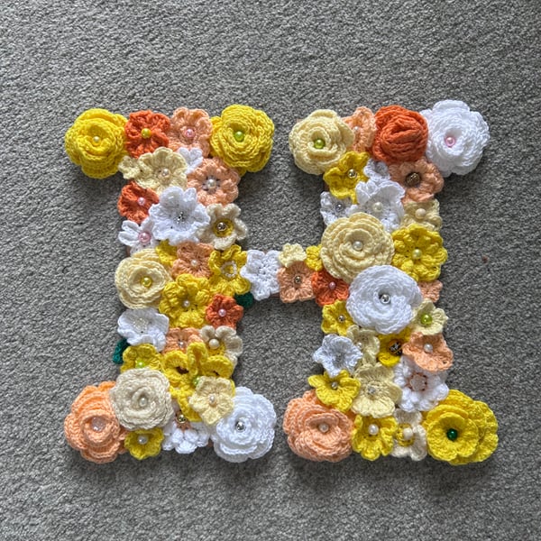 Initial H - hand made crochet flowers on plywood on back board