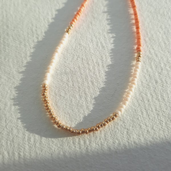 Glass beaded necklace, peach, cream and gold, 16 to 18 inches