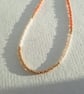 Glass beaded necklace, peach, cream and gold, 16 to 18 inches