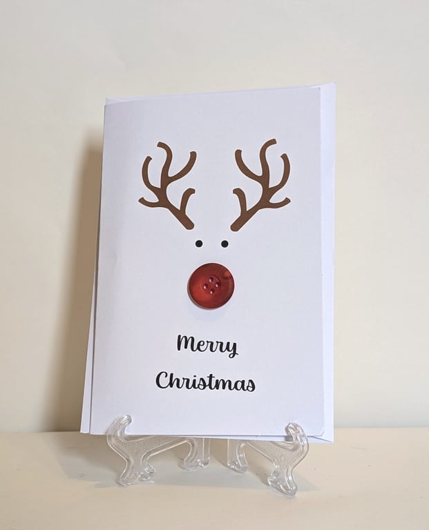 Merry Christmas card with a red nose button reindeer 
