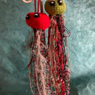 2 hand knitted sparkly jellyfish