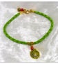 Bracelet Green Faux Leather with gold plated Seashell charm bead. - Image 1
