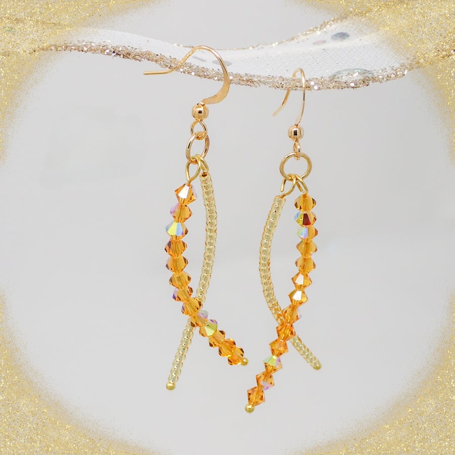 Gold Beaded Dangle Earrings with Sparkly Crystals.