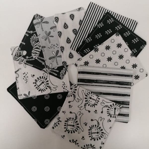 Set of 10 cotton fabric coasters in grey scale. 