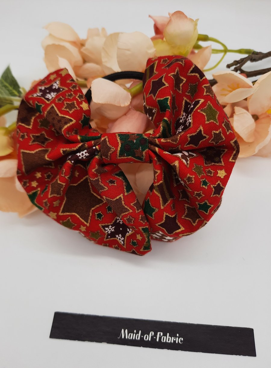 Hair bobble bow in red Christmas star fabric. Free uk delivery.  