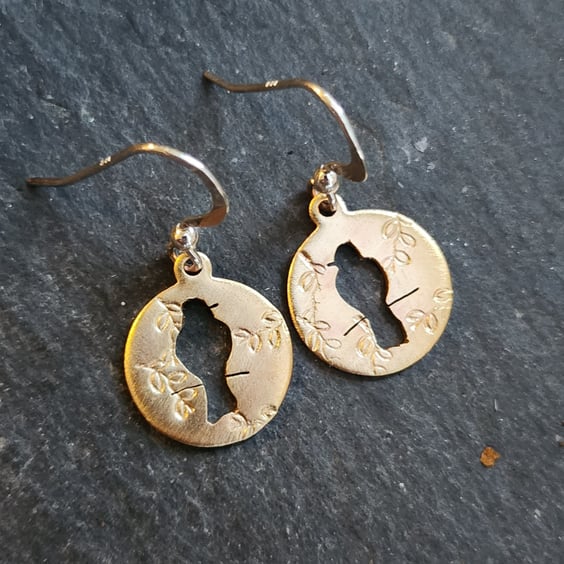 Brass circles with bird on branch cut out