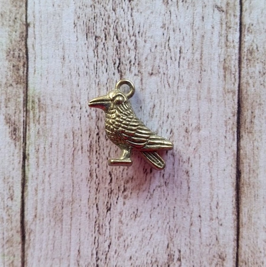 Bird charm pendant.