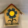 Embroidered fabric tea light bird house. 