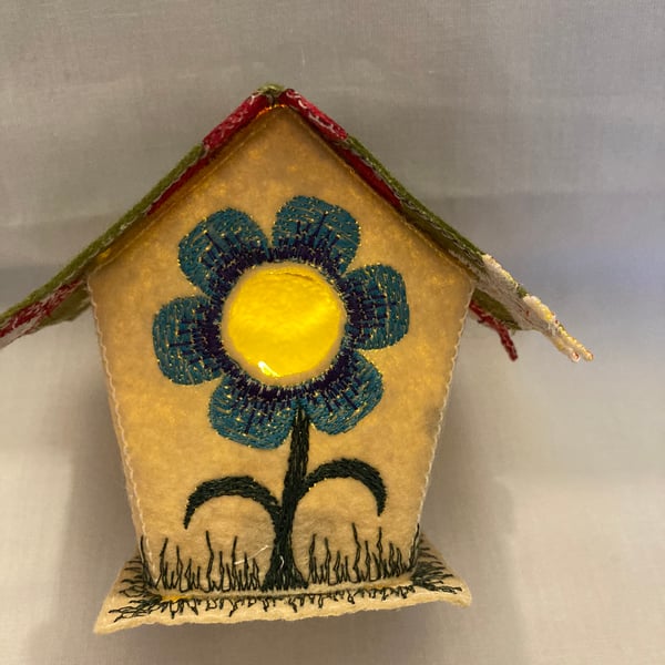 Embroidered fabric tea light bird house. 