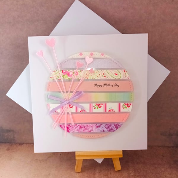 Delightful striped Happy Mother's Day card with heart flower decoration.
