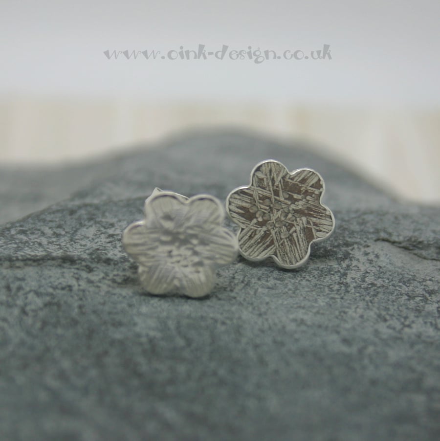 Sterling silver flower stud earrings with a textured finish
