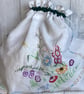 Travel packing laundry bag made from vintage embroidered cloth. Green trim 