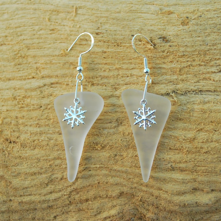 White glass earrings with snowflake charms