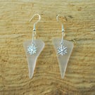White glass earrings with snowflake charms