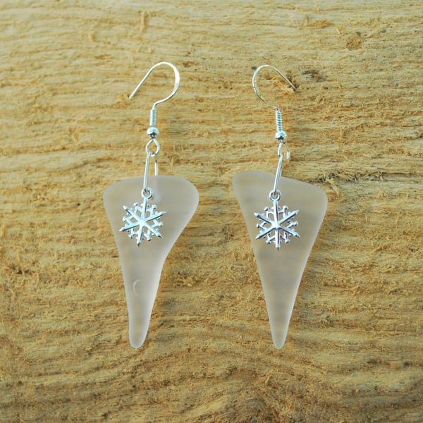 White glass earrings with snowflake charms