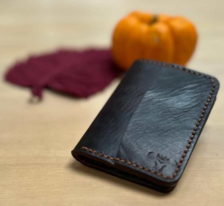 Bifold wallet made from repurposed saddle leather