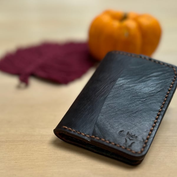 Bifold wallet made from repurposed saddle leather 