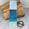 Embroidered up-cycled seascape bookmark. 