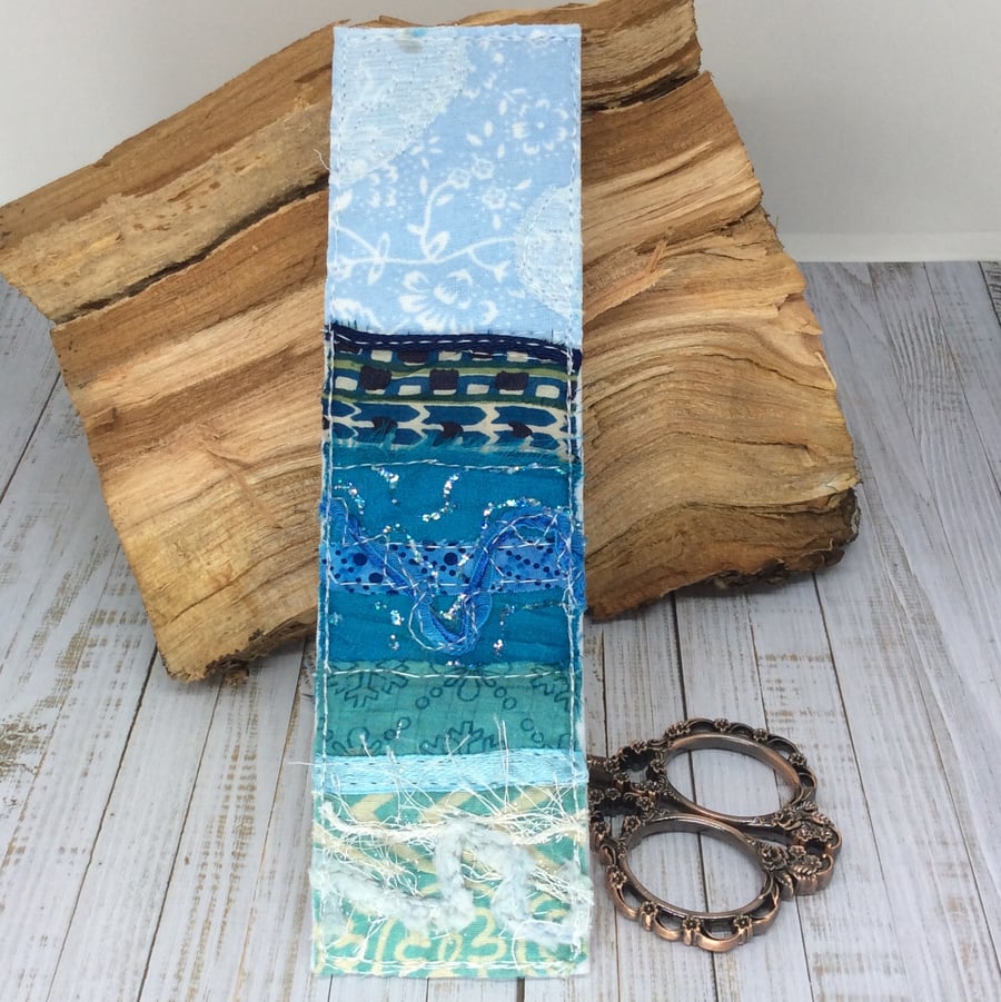 Embroidered up-cycled seascape bookmark. 