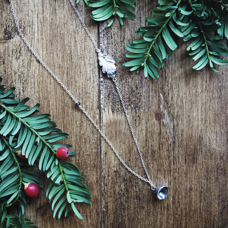 Long sterling silver necklace with leaf and acorn cap