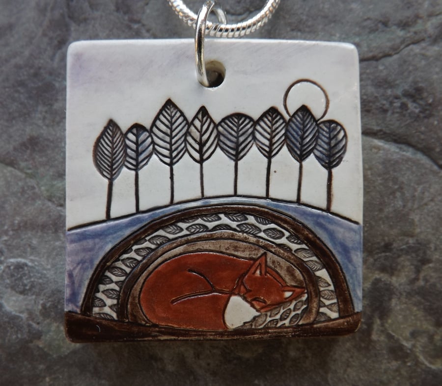 Handmade Ceramic Fox pendant in purple and brown