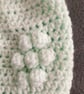 Matching ladies and baby green crocheted hats with detachable faux fur pompoms  - Image 7