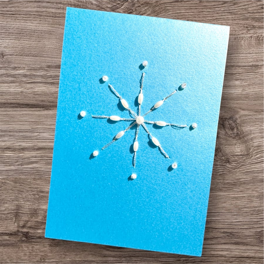 A hand embroidered Christmas card, beaded, snowflake. Unique