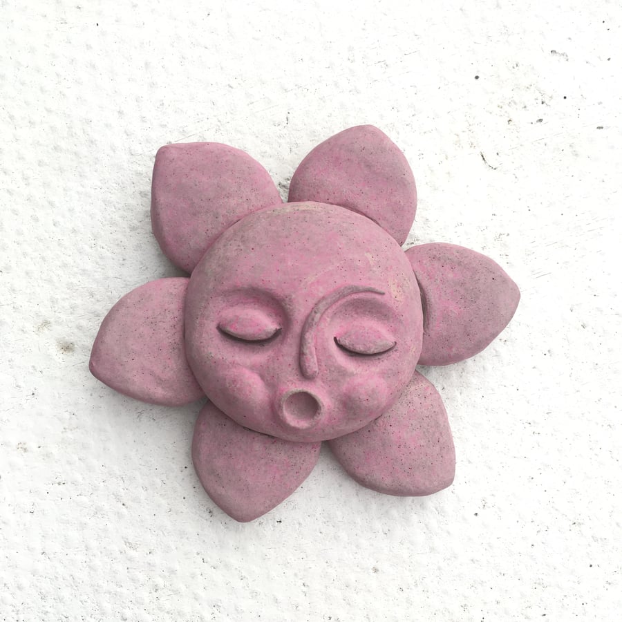 Cute concrete singing flower face
