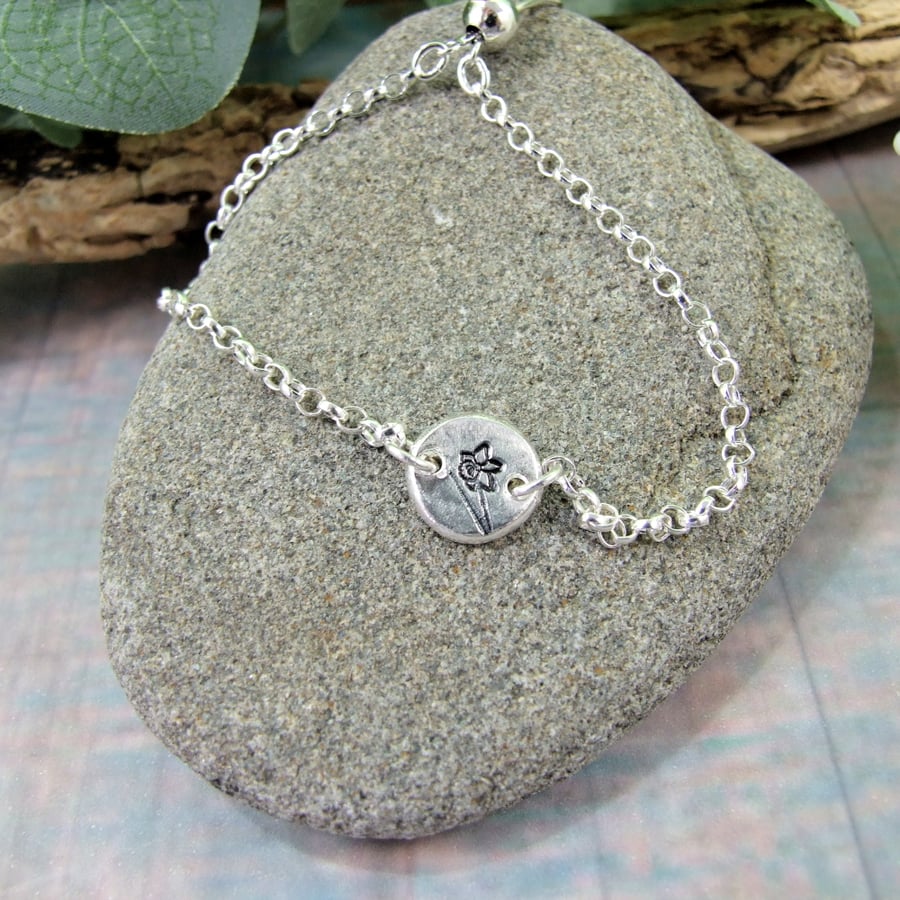 Sterling Silver Bracelet. Adjustable fit with Silver Flower Pebble 